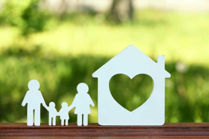 A happy family sitting together on a couch